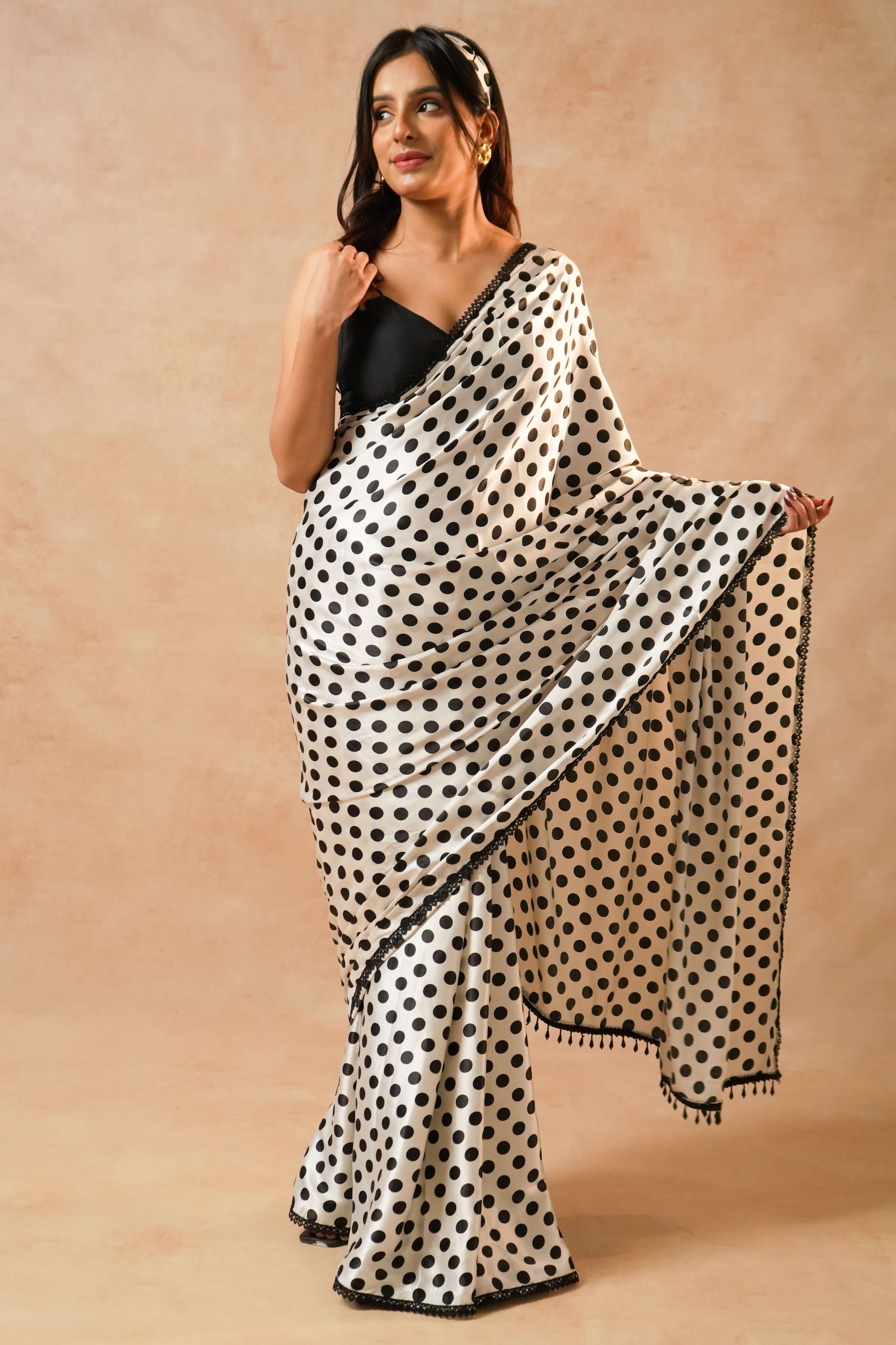 Naomi Designer Polka Dot Satin Saree with Crystal Lace worn elegantly, showcasing stylish black and white polka dots.