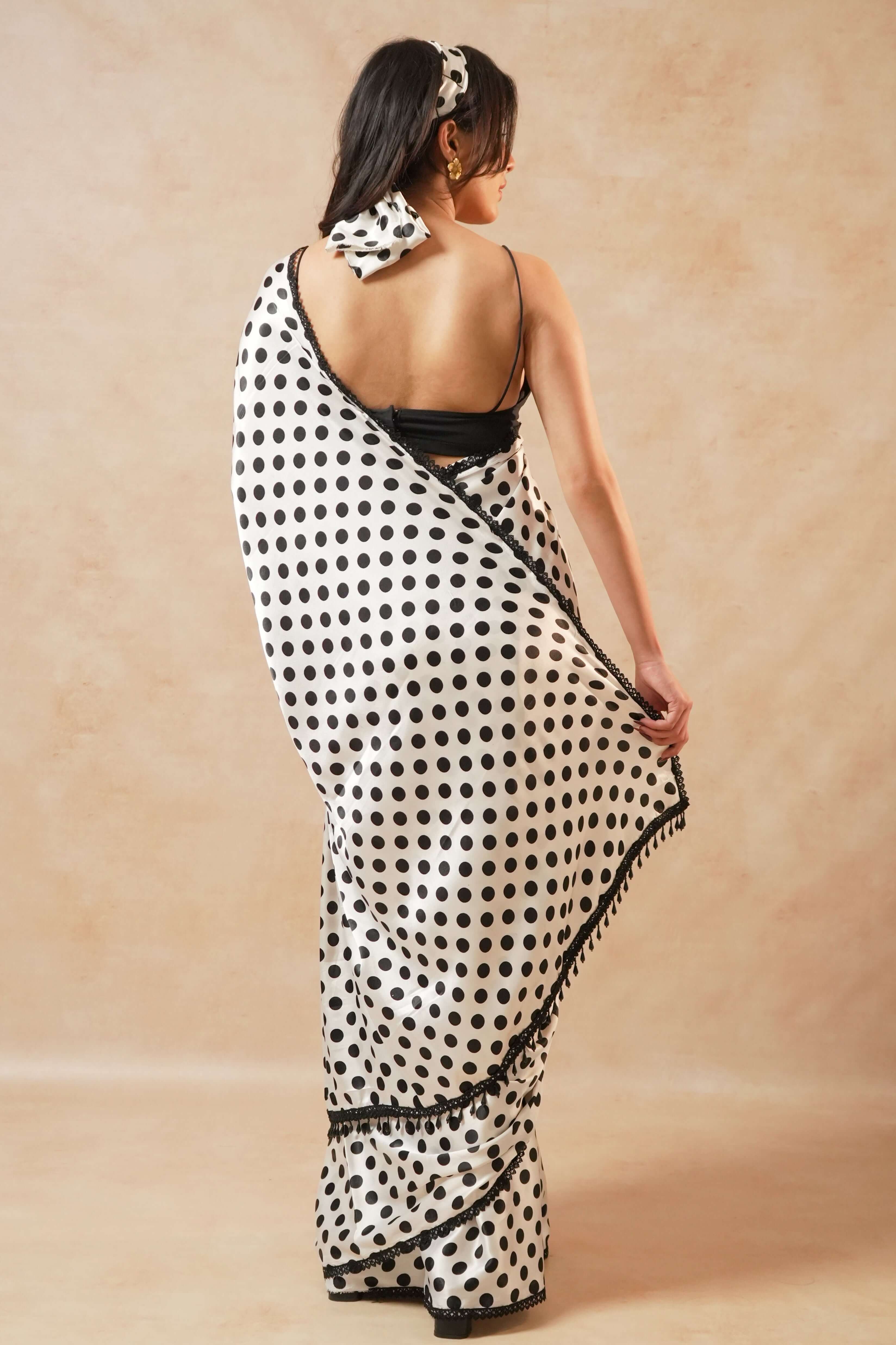 Naomi Designer Polka Dot Satin Saree with Crystal Lace displayed elegantly on a model from the back.