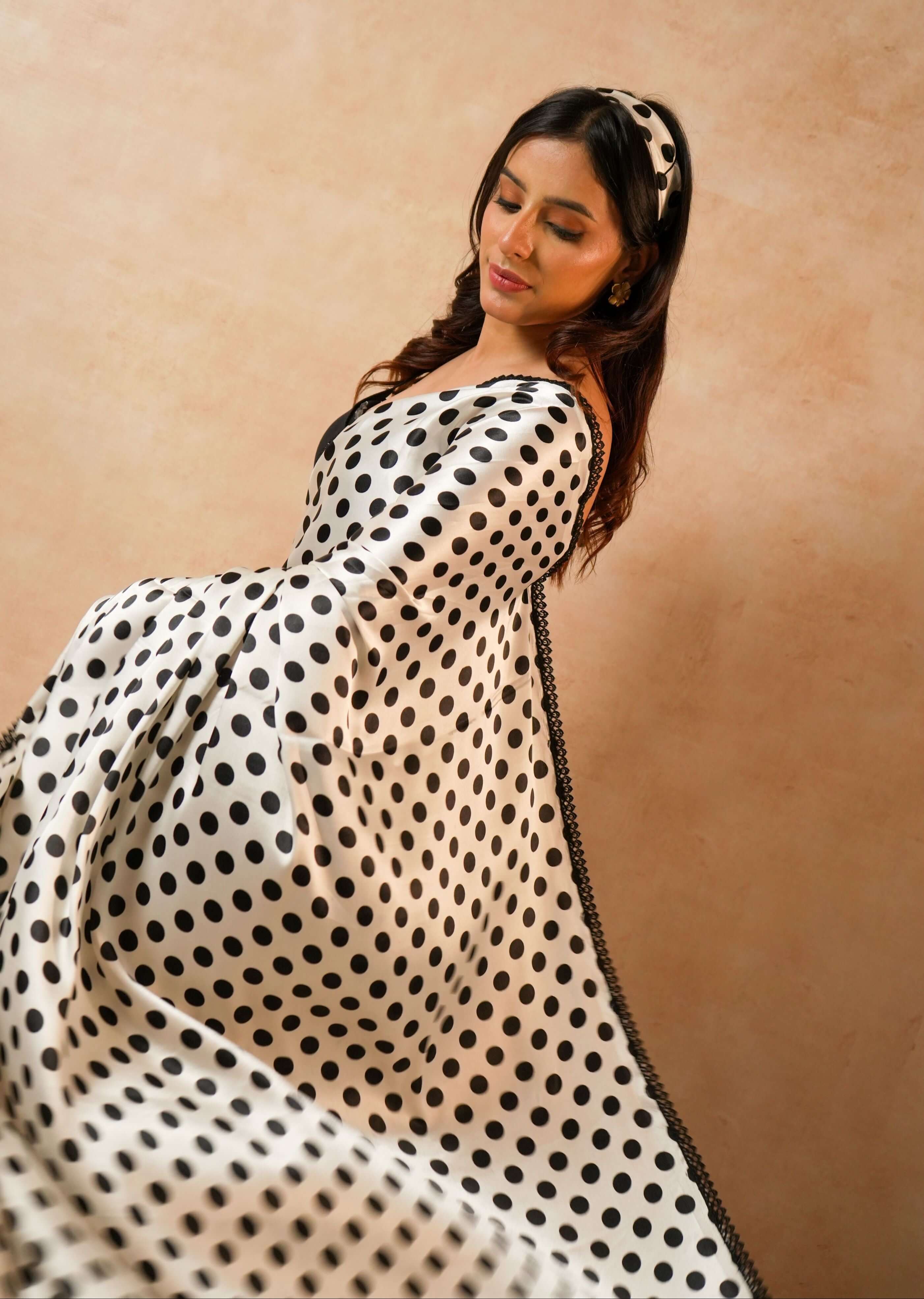 Naomi Designer Polka Dot Satin Saree with Crystal Lace worn by a model showcasing elegant draping and stylish design.