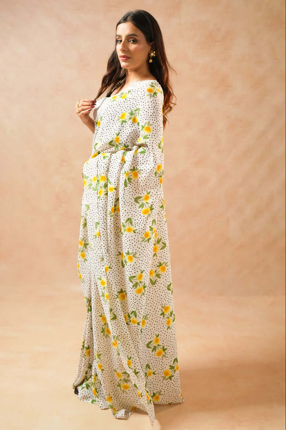 Flora Dot White Pure Georgette Saree with Floral Print worn by a model posing elegantly.