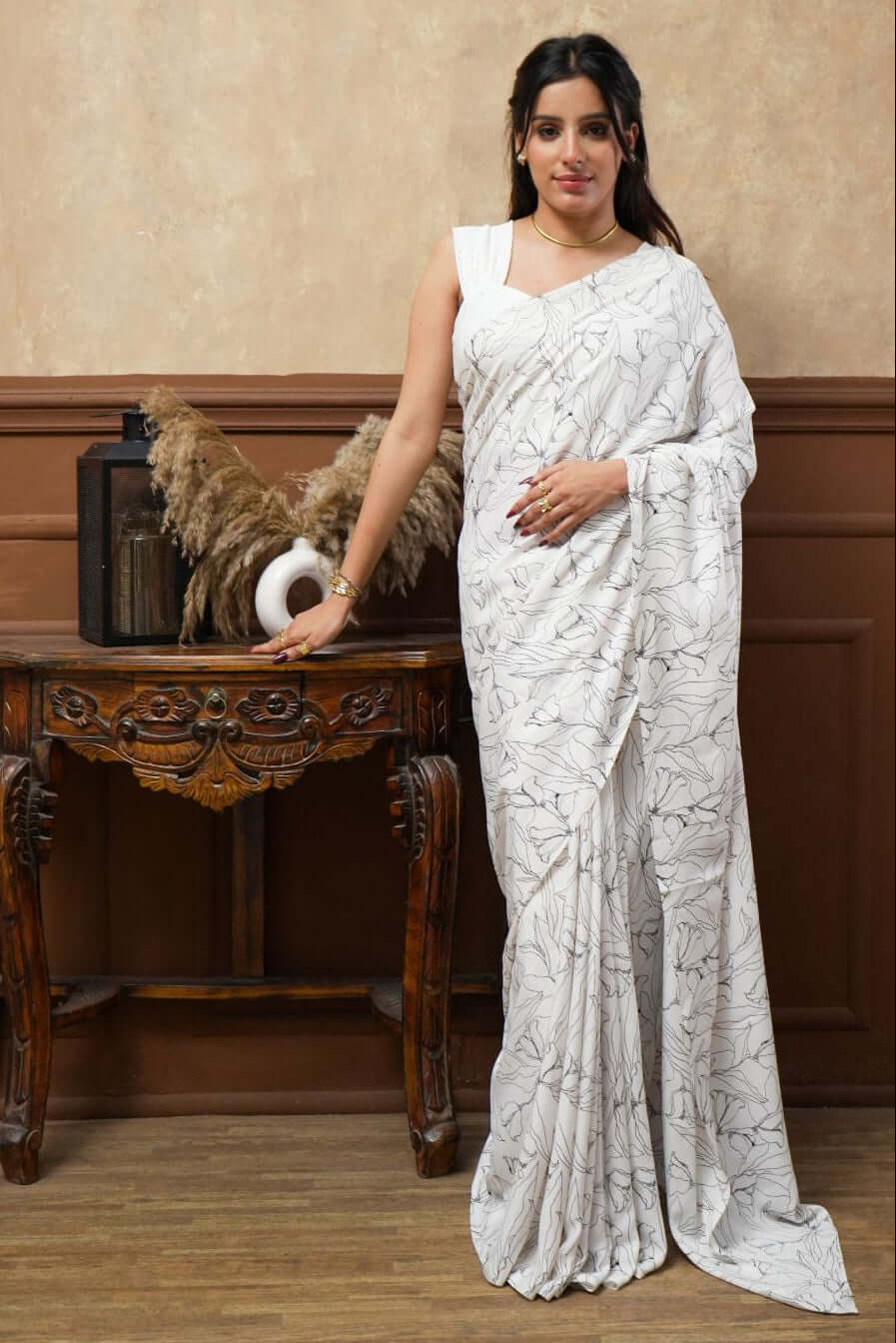 A woman models a White Tulip Digital Print Georgette Saree