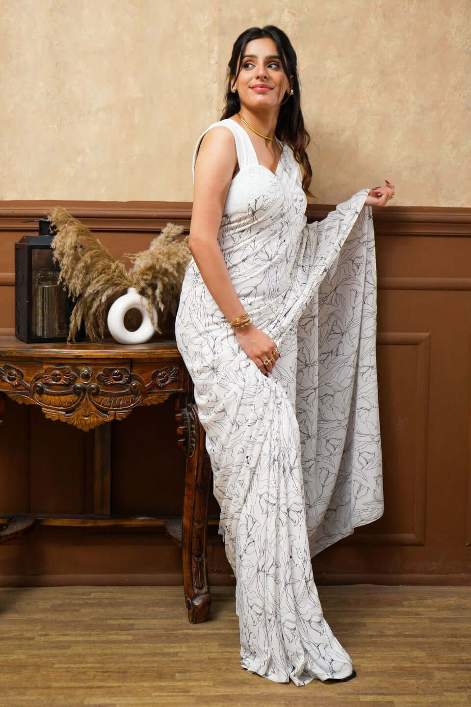 A woman models a White Tulip Digital Print Georgette Saree