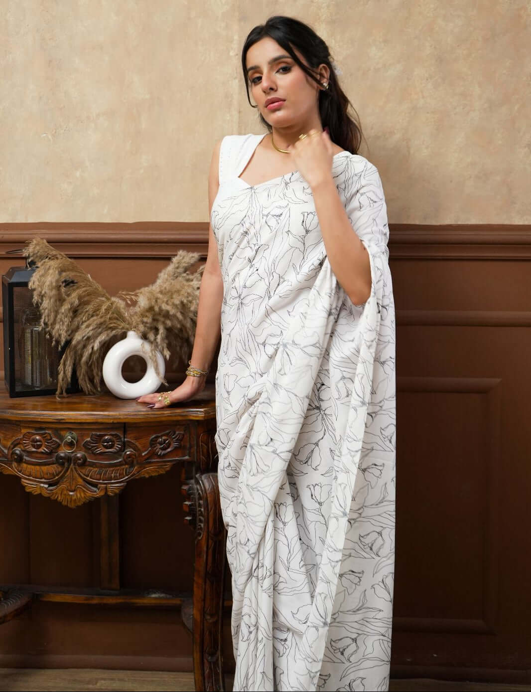 A woman models a White Tulip Digital Print Georgette Saree