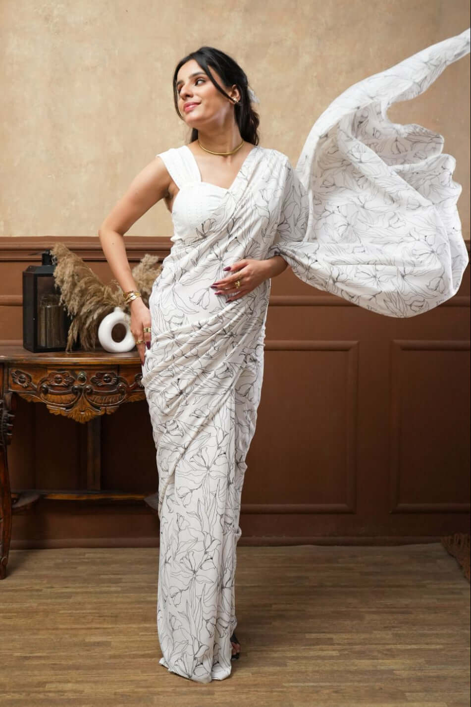 A woman models a White Tulip Digital Print Georgette Saree