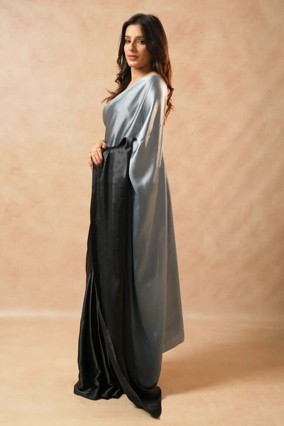 Shop the Moon Night Black Glass Shine Satin Saree in premium satin. 