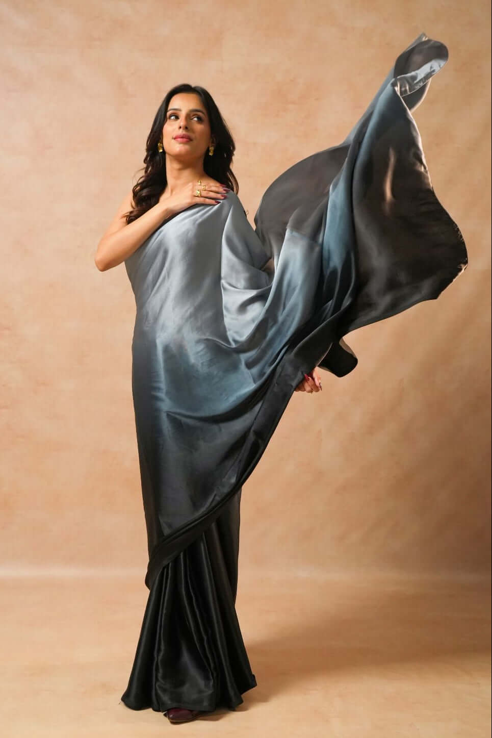 Shop the Moon Night Black Glass Shine Satin Saree in premium satin. 